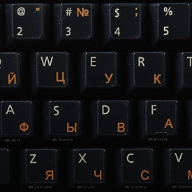 Russian Cyrillic keyboard stickers with orange lettering on transparent background